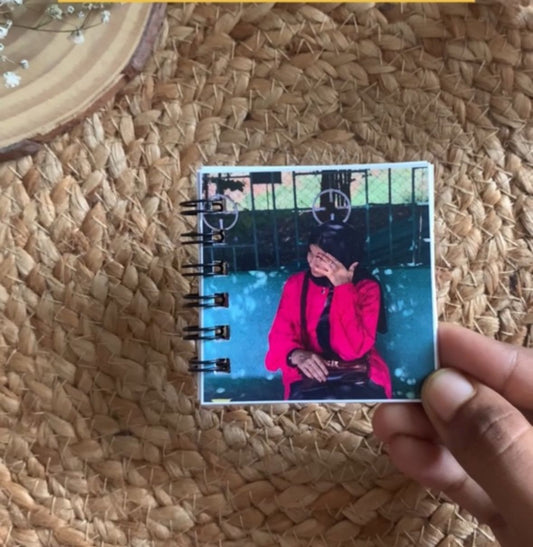 Handcrafted cute mini photo book with spiral binding, personalized keepsake gift held in hand