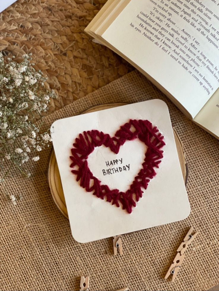 Handcrafted heart greeting card with red petal design on white background, personalized keepsake gift