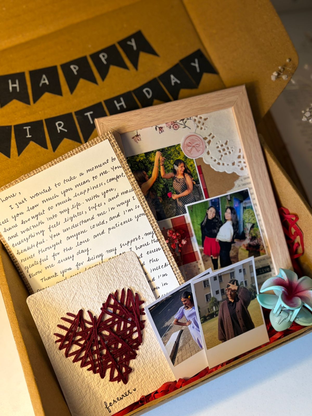 Handcrafted Cute Gift Hamper with letter, frame, heart card and flower clip arranged in box