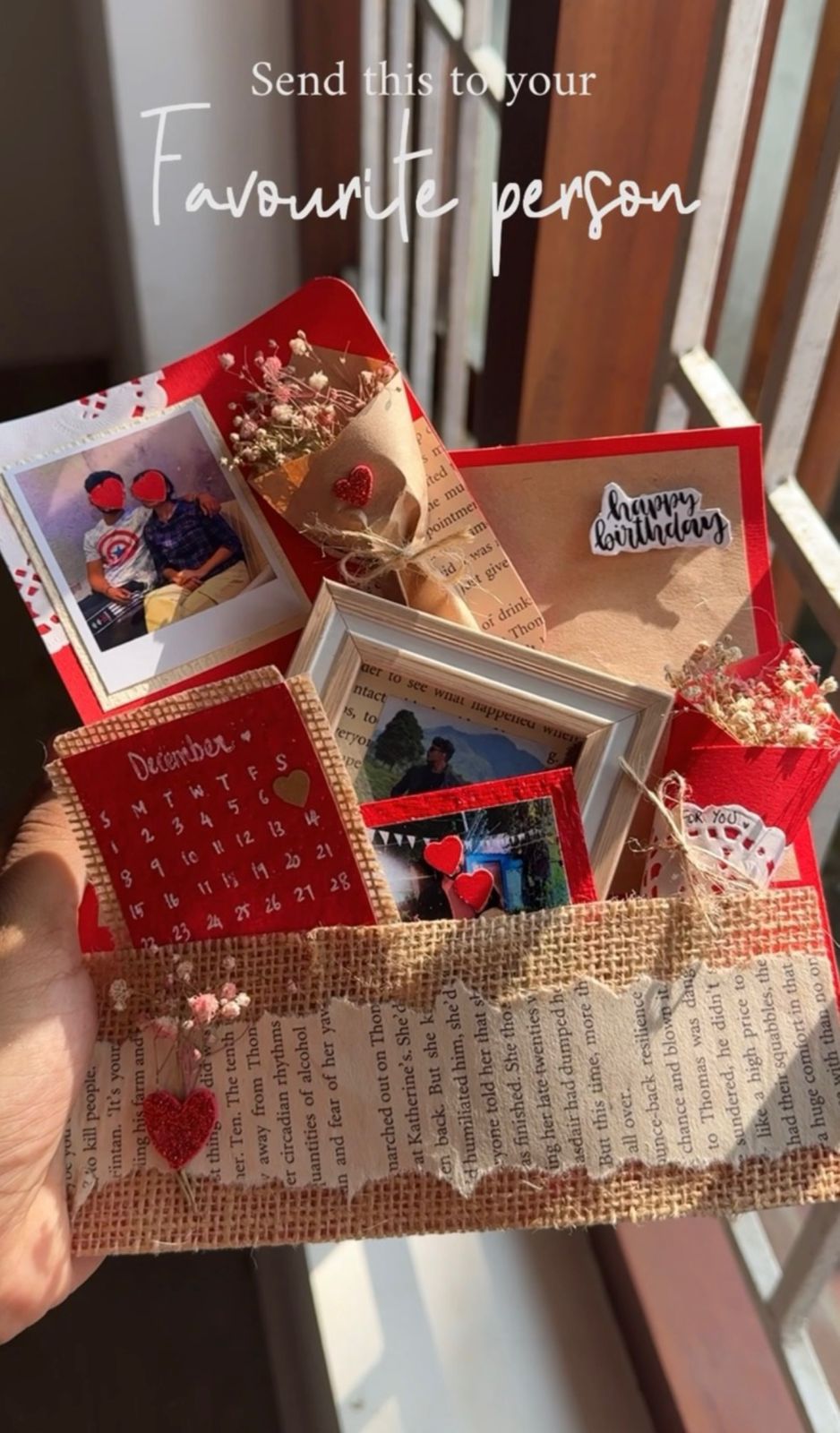 Red theme polaroid photo hamper with calendar, frame and flowers
