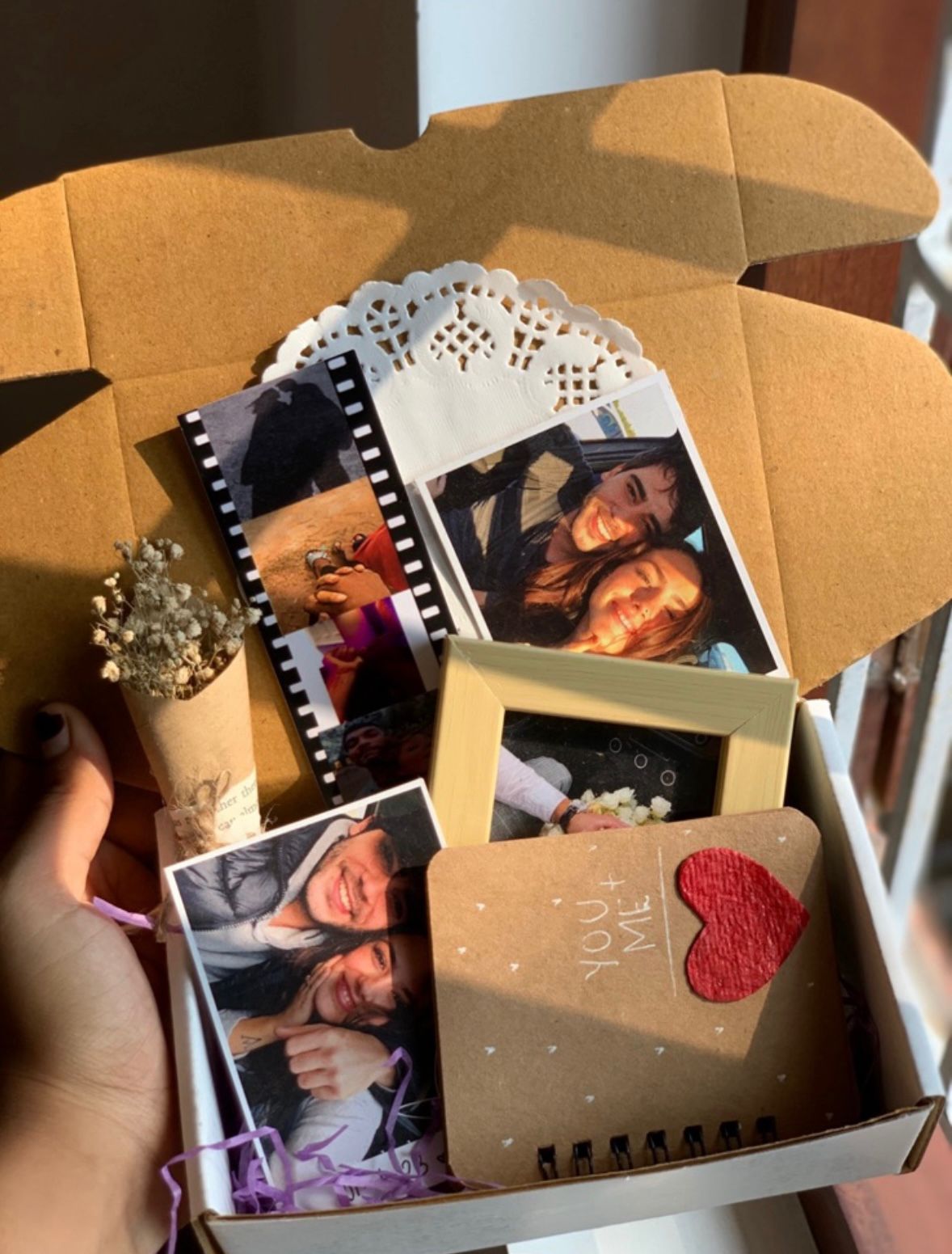 Vintage polaroid photo hamper with frame, ring book and flowers
