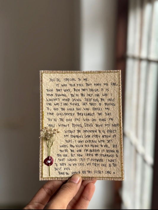 Handcrafted letter with wax seal held near window, elegant vintage greeting card gift